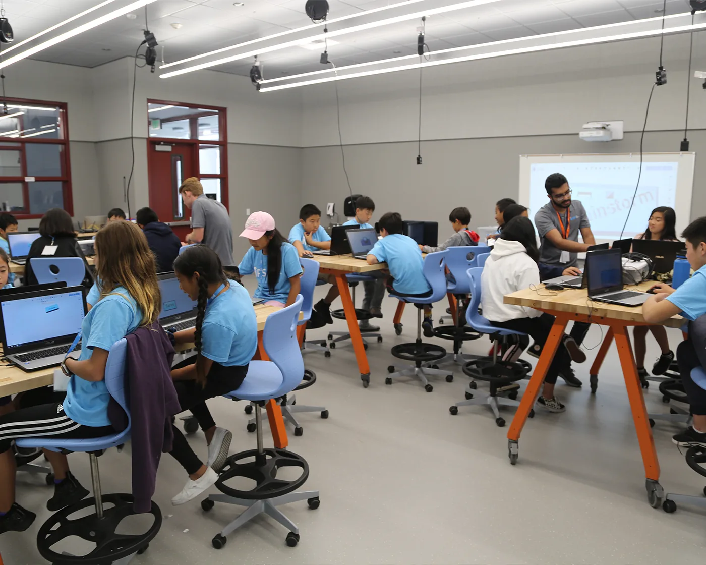 A BrainStorm instructor leading a hands-on STEM lesson.