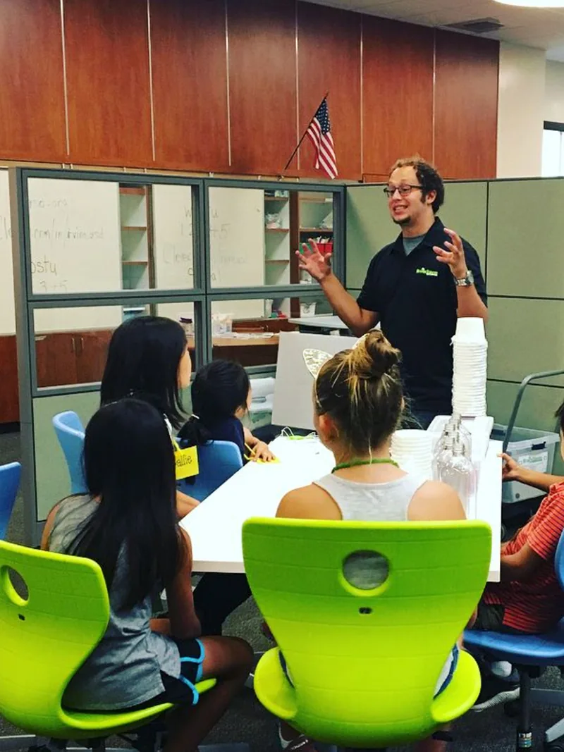 A BrainStorm STEM educator working with students.