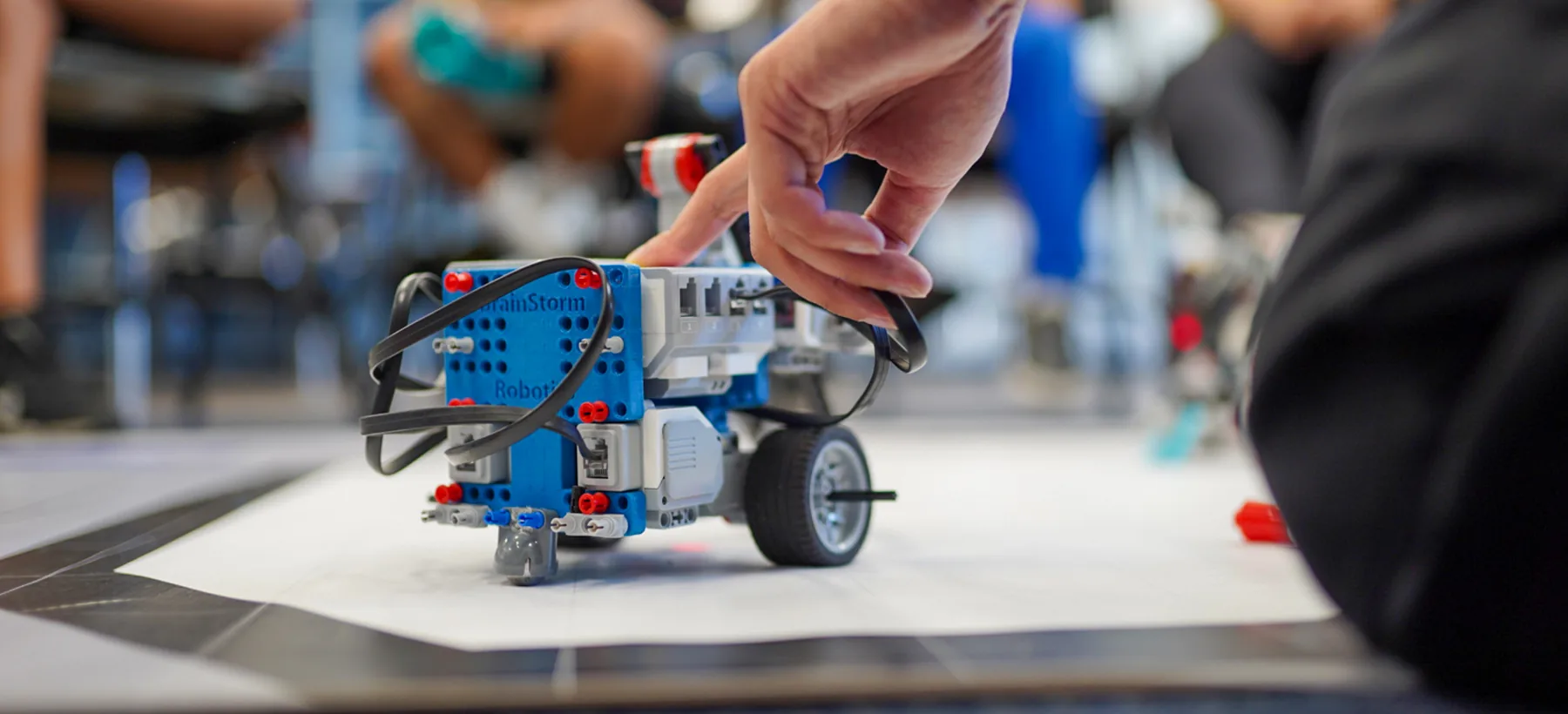 Students building a robotics project at a BrainStorm Robotics & Engineering Academy.