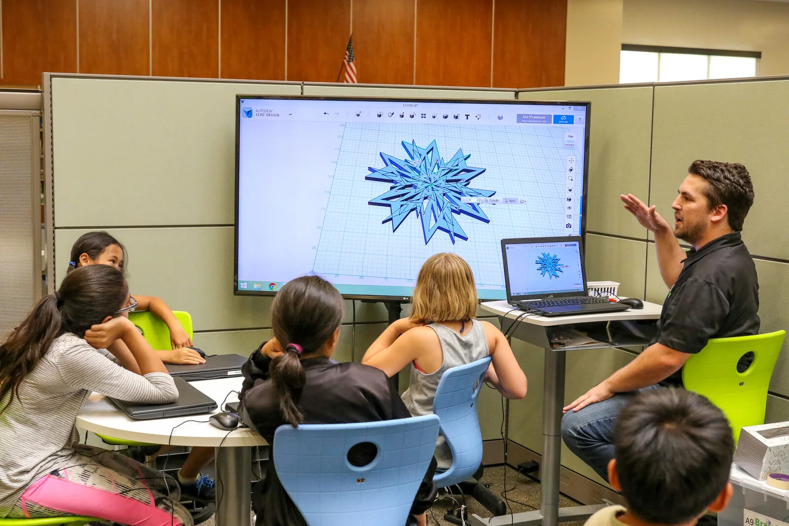 A BrainStorm instructor leading students through a hands-on 3D design technology lesson.