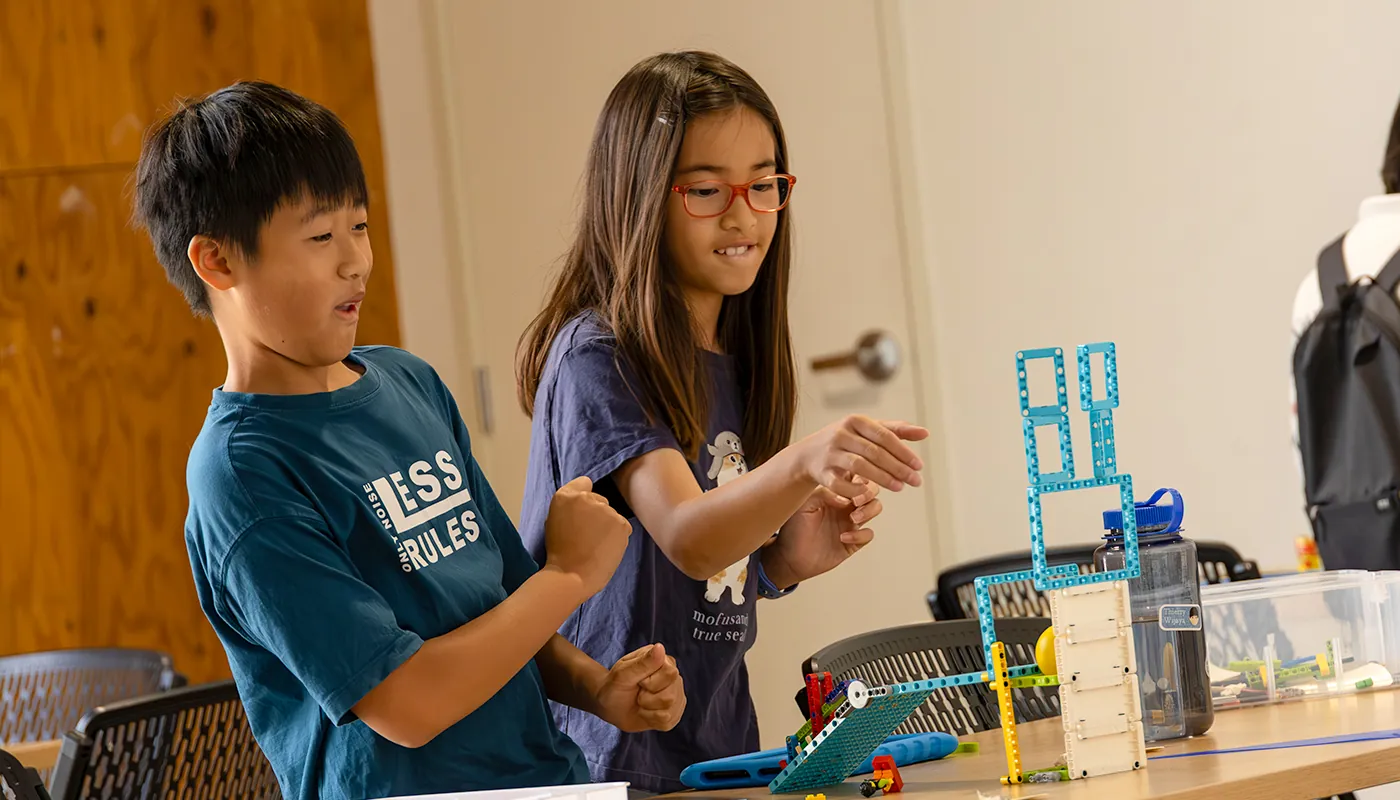 Students demonstrating a robotics and engineering project.