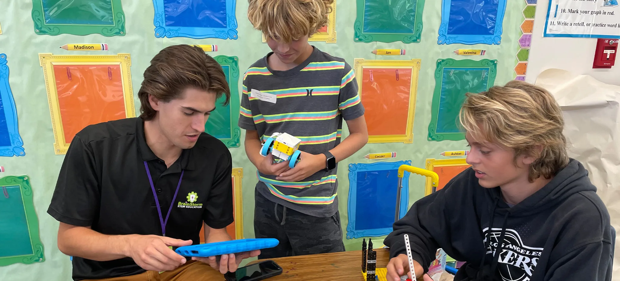 A BrainStorm instructor leading a classroom of students through a STEM lesson.