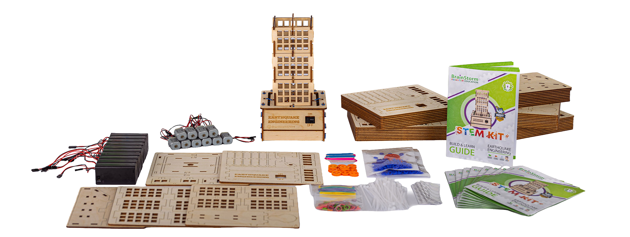 A full Earthquake Engineering class pack laid out: battery packs, motors, the assembled tower, wooden base kits, hardware, rubber bands, ties, and a stack of Build and Learn Guides.